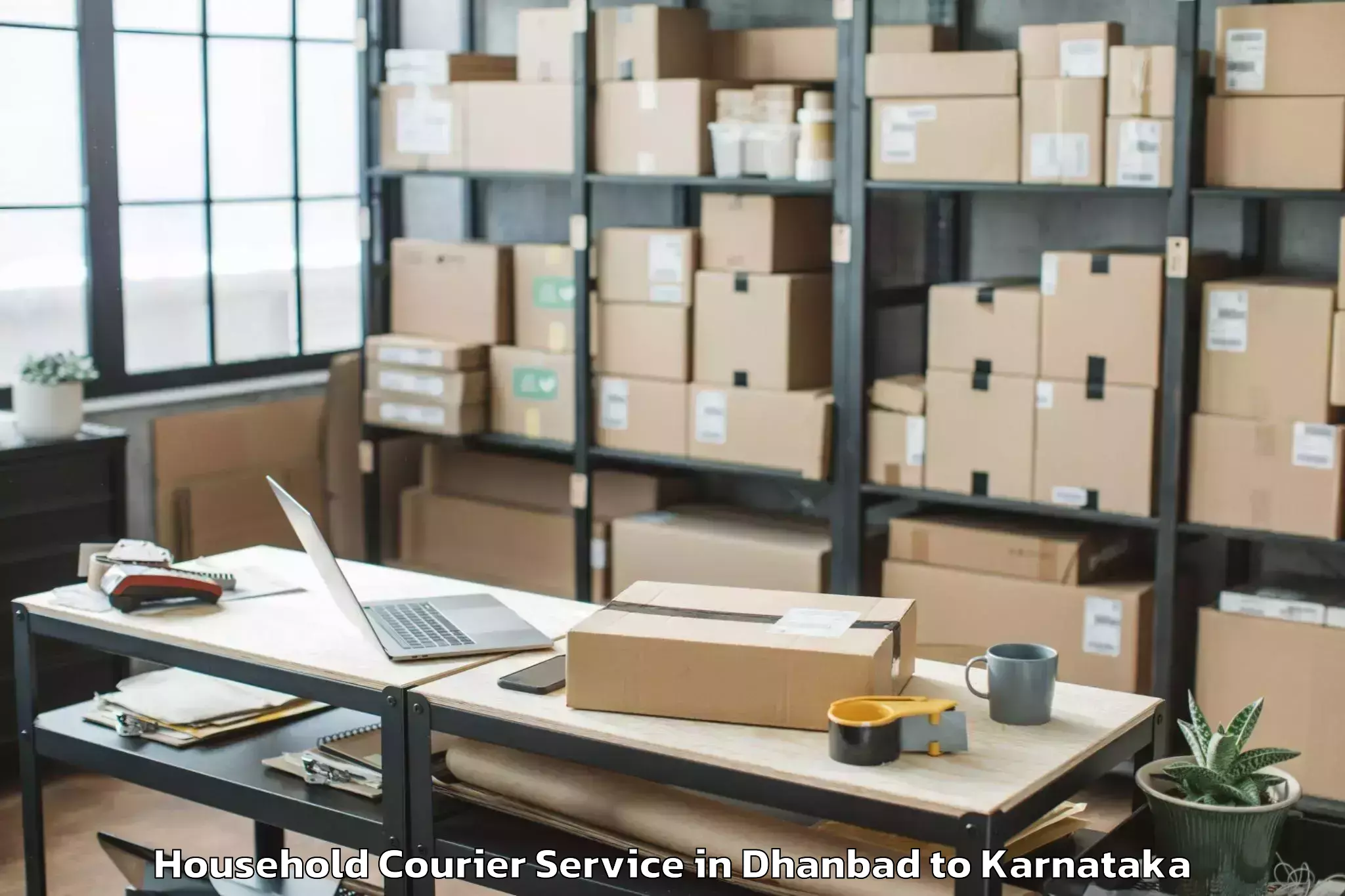 Easy Dhanbad to Karnataka Janapada Vishwavidya Household Courier Booking